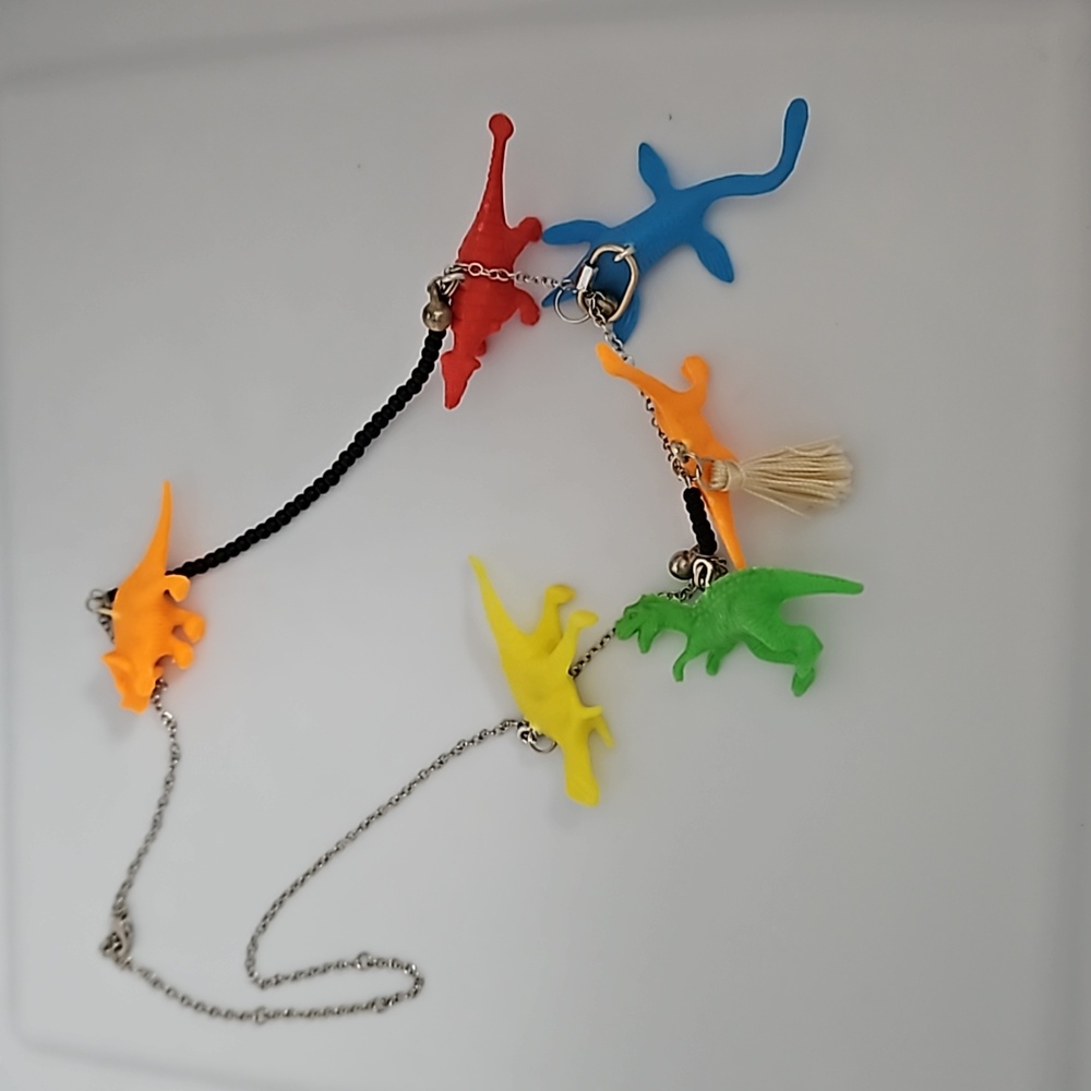 Dinosaur black and metal necklace